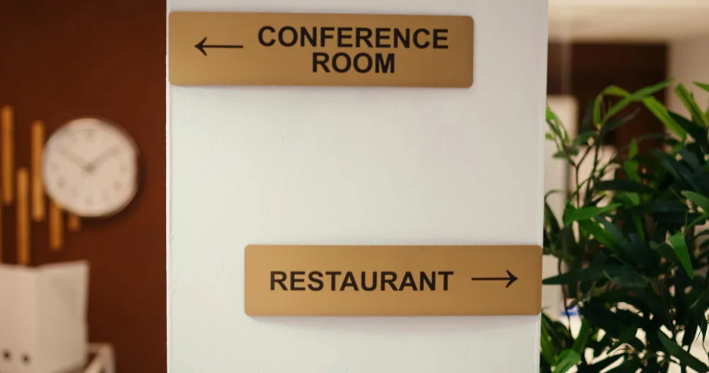 Corporate directional signage on an office wall